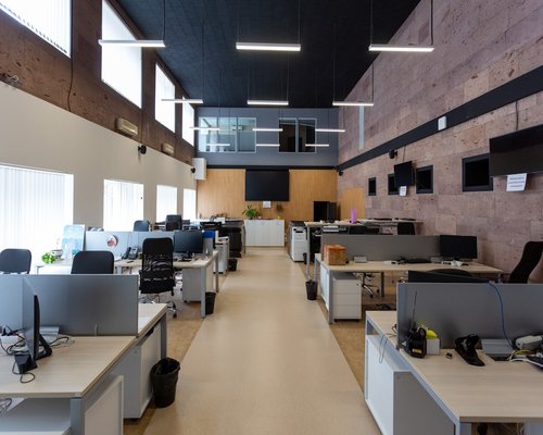 Modern office workspace with natural lighting and ergonomic setup